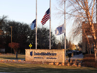 The front of the UnitedHealthcare corporate headquarters in Minnetonka, Minnesota, on December 5, 2024, shows flags flying at half-mast for...