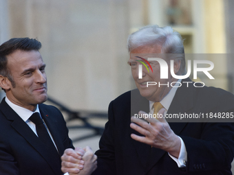 France's President Emmanuel Macron welcomes the United States President-elect Donald Trump before the bilateral talks in Paris, France, on D...