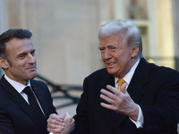 France's President Emmanuel Macron welcomes the United States President-elect Donald Trump before the bilateral talks in Paris, France, on D...