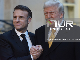 France's President Emmanuel Macron welcomes the United States President-elect Donald Trump before the bilateral talks in Paris, France, on D...