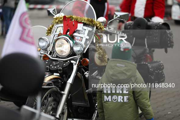 Motorcyclists in Santa Claus costumes get ready for the parade at EXPO Krakow in Krakow, Poland, on December 8, 2024. Santas on motorbikes r...