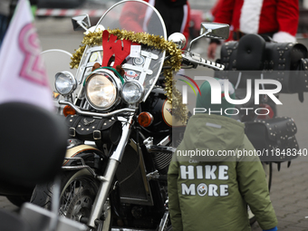 Motorcyclists in Santa Claus costumes get ready for the parade at EXPO Krakow in Krakow, Poland, on December 8, 2024. Santas on motorbikes r...