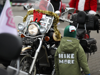 Motorcyclists in Santa Claus costumes get ready for the parade at EXPO Krakow in Krakow, Poland, on December 8, 2024. Santas on motorbikes r...