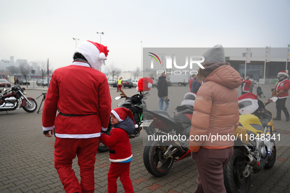 Motorcyclists in Santa Claus costumes get ready for the parade at EXPO Krakow in Krakow, Poland, on December 8, 2024. Santas on motorbikes r...