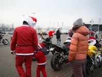 Motorcyclists in Santa Claus costumes get ready for the parade at EXPO Krakow in Krakow, Poland, on December 8, 2024. Santas on motorbikes r...