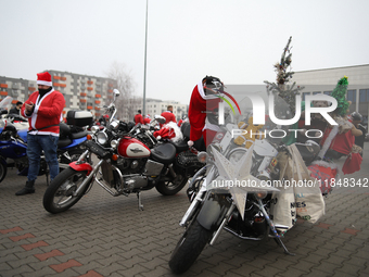 Motorcyclists in Santa Claus costumes get ready for the parade at EXPO Krakow in Krakow, Poland, on December 8, 2024. Santas on motorbikes r...