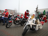 Motorcyclists in Santa Claus costumes get ready for the parade at EXPO Krakow in Krakow, Poland, on December 8, 2024. Santas on motorbikes r...