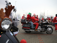 Motorcyclists in Santa Claus costumes get ready for the parade at EXPO Krakow in Krakow, Poland, on December 8, 2024. Santas on motorbikes r...