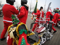 Motorcyclists in Santa Claus costumes get ready for the parade at EXPO Krakow in Krakow, Poland, on December 8, 2024. Santas on motorbikes r...