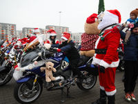 Motorcyclists in Santa Claus costumes get ready for the parade at EXPO Krakow in Krakow, Poland, on December 8, 2024. Santas on motorbikes r...