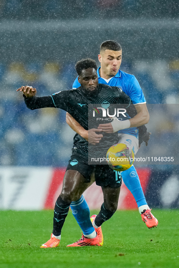 Alessandro Buongiorno of SSC Napoli and Boulaye Dia of SS Lazio compete for the ball during the serie Serie A Enilive match between SSC Napo...