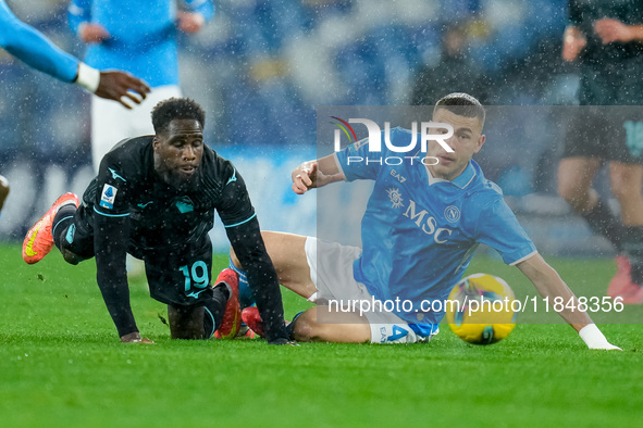 Alessandro Buongiorno of SSC Napoli and Boulaye Dia of SS Lazio compete for the ball during the serie Serie A Enilive match between SSC Napo...