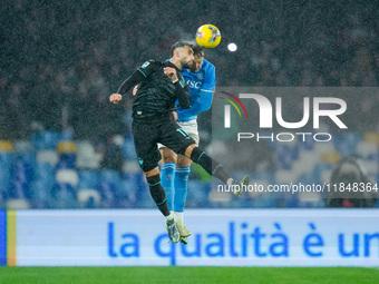 Taty Castellanos of SS Lazio and Amir Rrahmani of SSC Napoli jump for the ball during the serie Serie A Enilive match between SSC Napoli and...