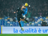 Taty Castellanos of SS Lazio and Amir Rrahmani of SSC Napoli jump for the ball during the serie Serie A Enilive match between SSC Napoli and...