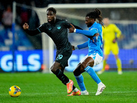 Boulaye Dia of SS Lazio and Andre-Frank Zambo Anguissa of SSC Napoli compete for the ball during the serie Serie A Enilive match between SSC...