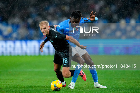 Andre-Frank Zambo Anguissa of SSC Napoli and Gustav Isaksen of SS Lazio compete for the ball during the serie Serie A Enilive match between...