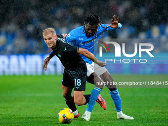 Andre-Frank Zambo Anguissa of SSC Napoli and Gustav Isaksen of SS Lazio compete for the ball during the serie Serie A Enilive match between...