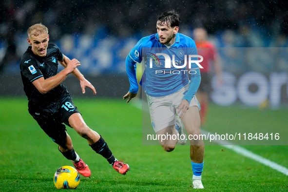 Khvicha Kvaratskhelia of SSC Napoli and Gustav Isaksen of SS Lazio compete for the ball during the serie Serie A Enilive match between SSC N...