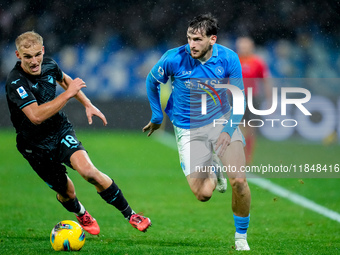 Khvicha Kvaratskhelia of SSC Napoli and Gustav Isaksen of SS Lazio compete for the ball during the serie Serie A Enilive match between SSC N...