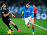 Khvicha Kvaratskhelia of SSC Napoli and Gustav Isaksen of SS Lazio compete for the ball during the serie Serie A Enilive match between SSC N...