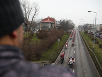 In Krakow, Poland, on December 8, 2024, motorcyclists in Santa costumes ride through the streets of the city to the University Children's Ho...