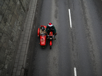 In Krakow, Poland, on December 8, 2024, motorcyclists in Santa costumes ride through the streets of the city to the University Children's Ho...