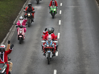 In Krakow, Poland, on December 8, 2024, motorcyclists in Santa costumes ride through the streets of the city to the University Children's Ho...