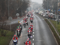 In Krakow, Poland, on December 8, 2024, motorcyclists in Santa costumes ride through the streets of the city to the University Children's Ho...