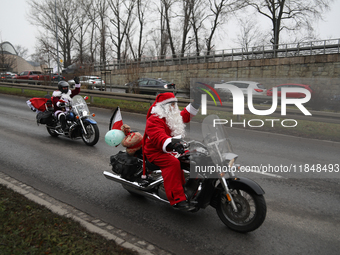 In Krakow, Poland, on December 8, 2024, motorcyclists in Santa costumes ride through the streets of the city to the University Children's Ho...