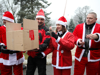 In Krakow, Poland, on December 8, 2024, motorcyclists in Santa costumes hand out gifts at the University Children's Hospital. Santas on moto...