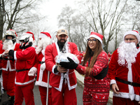 In Krakow, Poland, on December 8, 2024, motorcyclists in Santa costumes hand out gifts at the University Children's Hospital. Santas on moto...