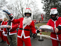 In Krakow, Poland, on December 8, 2024, motorcyclists in Santa costumes hand out gifts at the University Children's Hospital. Santas on moto...