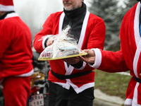 In Krakow, Poland, on December 8, 2024, motorcyclists in Santa costumes hand out gifts at the University Children's Hospital. Santas on moto...