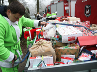 In Krakow, Poland, on December 8, 2024, motorcyclists in Santa costumes hand out gifts at the University Children's Hospital. Santas on moto...