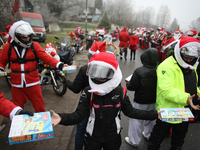 In Krakow, Poland, on December 8, 2024, motorcyclists in Santa costumes hand out gifts at the University Children's Hospital. Santas on moto...