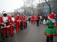 In Krakow, Poland, on December 8, 2024, motorcyclists in Santa costumes hand out gifts at the University Children's Hospital. Santas on moto...