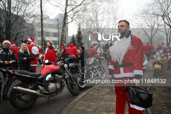 In Krakow, Poland, on December 8, 2024, motorcyclists in Santa costumes hand out gifts at the University Children's Hospital. Santas on moto...