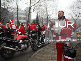 In Krakow, Poland, on December 8, 2024, motorcyclists in Santa costumes hand out gifts at the University Children's Hospital. Santas on moto...