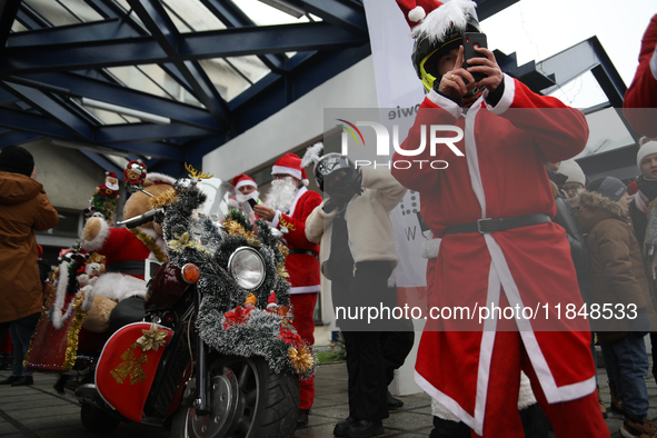 In Krakow, Poland, on December 8, 2024, motorcyclists in Santa costumes hand out gifts at the University Children's Hospital. Santas on moto...