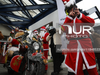 In Krakow, Poland, on December 8, 2024, motorcyclists in Santa costumes hand out gifts at the University Children's Hospital. Santas on moto...