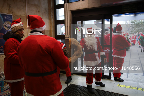 In Krakow, Poland, on December 8, 2024, motorcyclists in Santa costumes hand out gifts at the University Children's Hospital. Santas on moto...