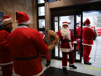 In Krakow, Poland, on December 8, 2024, motorcyclists in Santa costumes hand out gifts at the University Children's Hospital. Santas on moto...