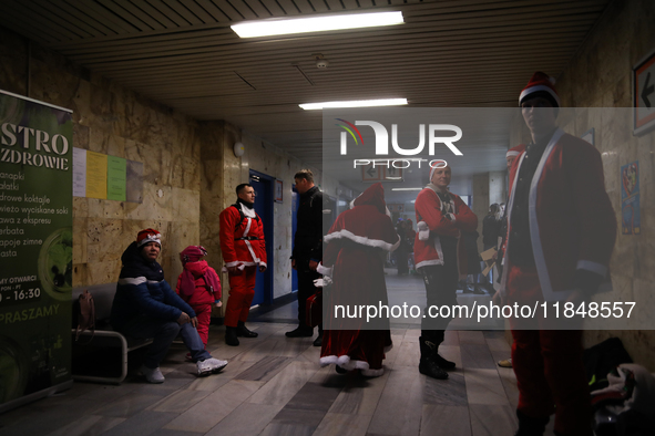 In Krakow, Poland, on December 8, 2024, motorcyclists in Santa costumes hand out gifts at the University Children's Hospital. Santas on moto...