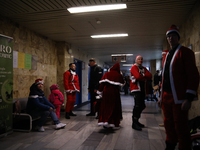 In Krakow, Poland, on December 8, 2024, motorcyclists in Santa costumes hand out gifts at the University Children's Hospital. Santas on moto...