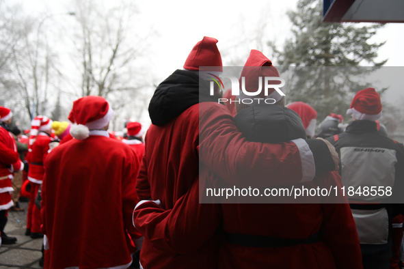 In Krakow, Poland, on December 8, 2024, motorcyclists in Santa costumes hand out gifts at the University Children's Hospital. Santas on moto...