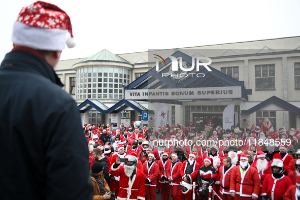 In Krakow, Poland, on December 8, 2024, motorcyclists in Santa costumes hand out gifts at the University Children's Hospital. Santas on moto...