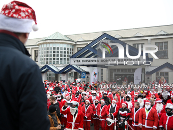 In Krakow, Poland, on December 8, 2024, motorcyclists in Santa costumes hand out gifts at the University Children's Hospital. Santas on moto...