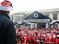 In Krakow, Poland, on December 8, 2024, motorcyclists in Santa costumes hand out gifts at the University Children's Hospital. Santas on moto...