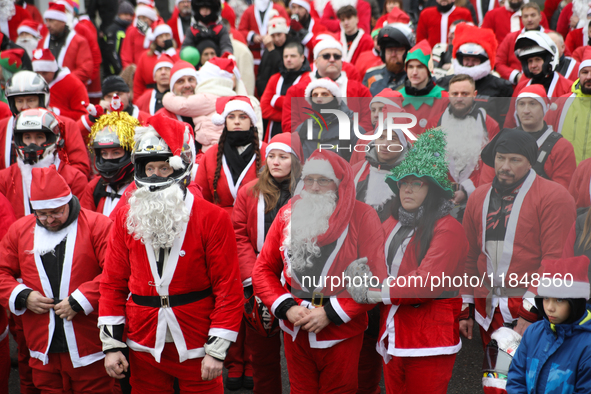 In Krakow, Poland, on December 8, 2024, motorcyclists in Santa costumes hand out gifts at the University Children's Hospital. Santas on moto...