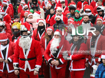 In Krakow, Poland, on December 8, 2024, motorcyclists in Santa costumes hand out gifts at the University Children's Hospital. Santas on moto...